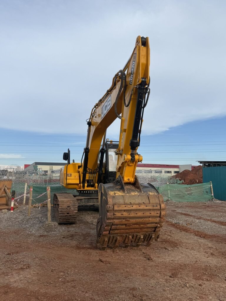 Excavator at a foundation piering job site