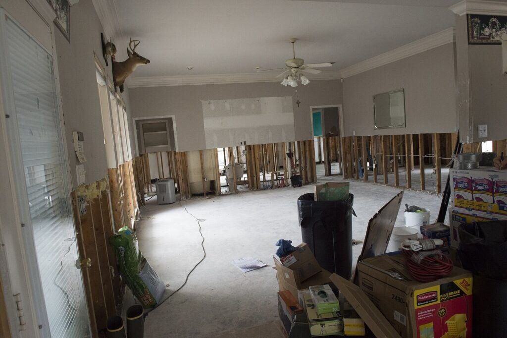 Flood damaged home in Louisiana with saturated drywall removed from the walls