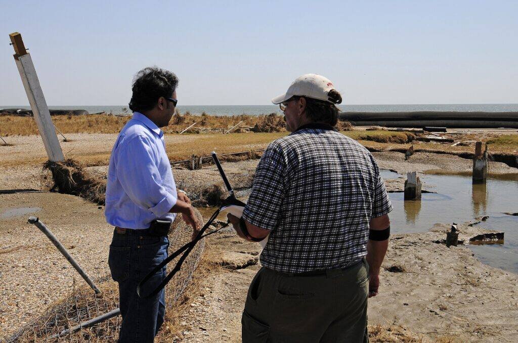 A house inspector talking with a homeowner about the home