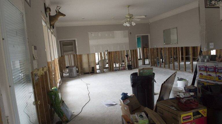 Flood damaged home in Louisiana with saturated drywall removed from the walls